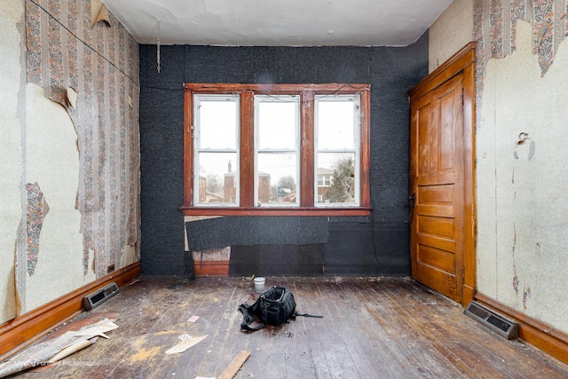 unfurnished room featuring dark hardwood / wood-style floors