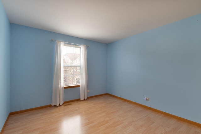 empty room with light wood-type flooring