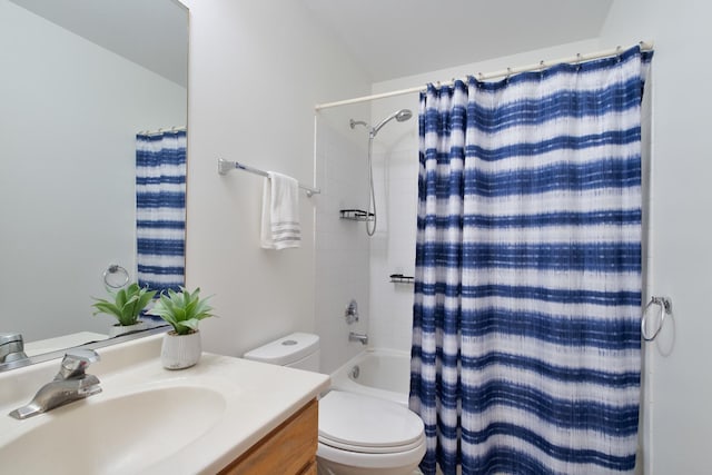 full bathroom featuring vanity, shower / tub combo, and toilet