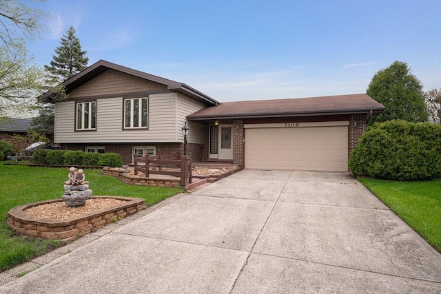 tri-level home featuring a garage and a front lawn