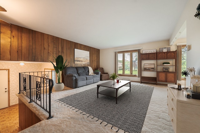 living room with wood walls