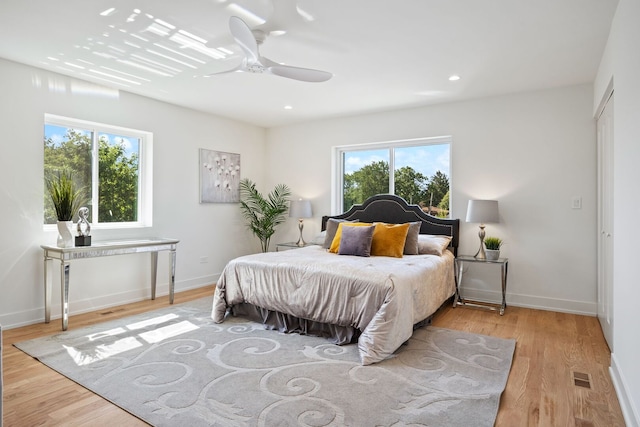 4932 Brummel St, Skokie, IL 60077 - bedroom with multiple windows, wood finished floors, ceiling fan, and recessed lighting
