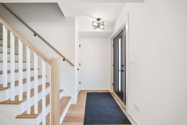 4932 Brummel St, Skokie, IL 60077 - entrance foyer with stairs and light wood-style flooring