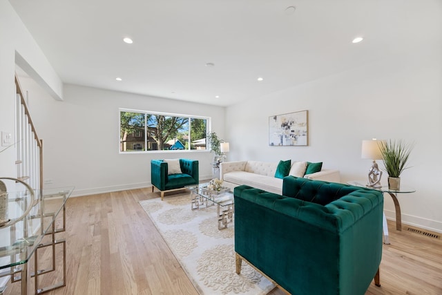 4932 Brummel St, Skokie, IL 60077 - living area featuring light wood-style floors, recessed lighting, and stairway