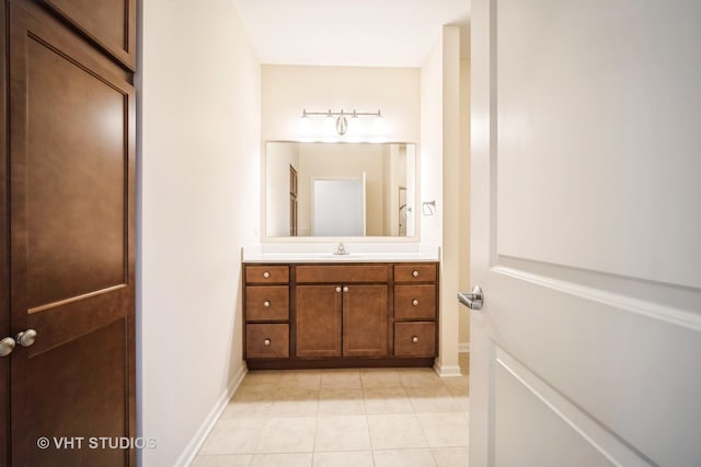 bathroom featuring tile patterned flooring and vanity