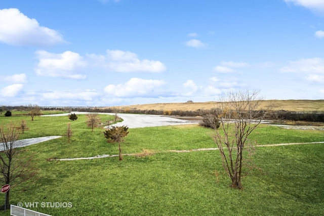 view of yard with a rural view