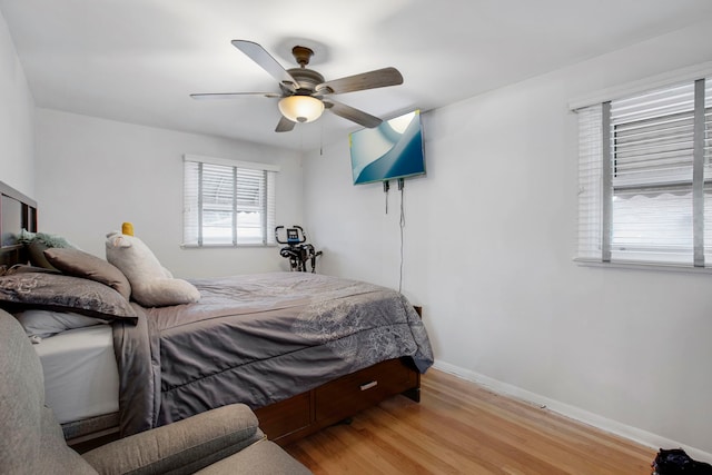 bedroom featuring light hardwood / wood-style floors and ceiling fan