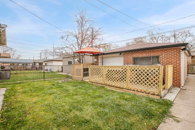 view of yard featuring a gazebo and a garage