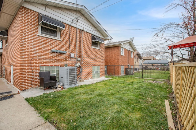 view of home's exterior featuring a yard and central air condition unit