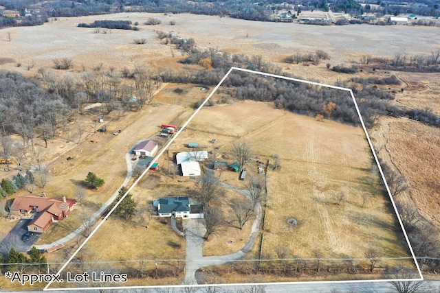 birds eye view of property with a rural view