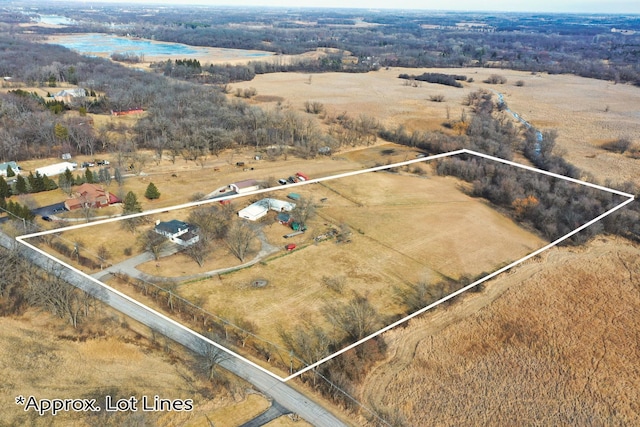 drone / aerial view with a water view and a rural view