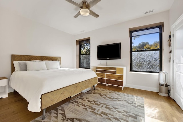 bedroom featuring wood-type flooring and ceiling fan