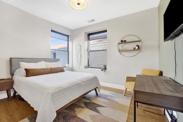 bedroom with wood-type flooring