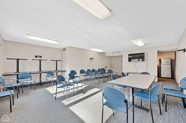 dining space featuring carpet flooring