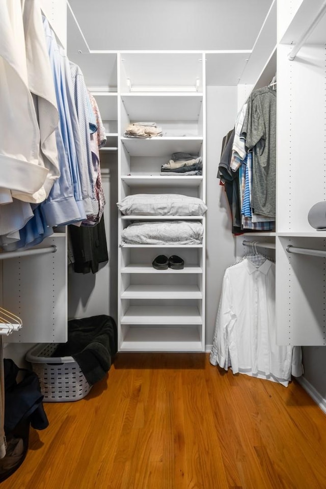 spacious closet featuring hardwood / wood-style floors