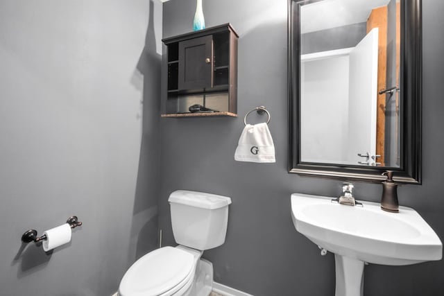 bathroom with sink and toilet