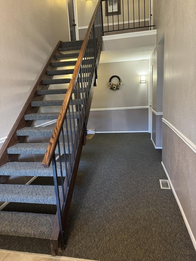 stairway with carpet flooring