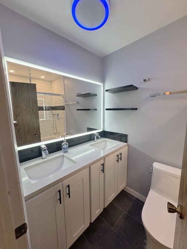 bathroom featuring vanity, tile patterned floors, toilet, and walk in shower