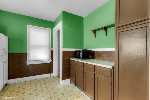 kitchen with tile walls