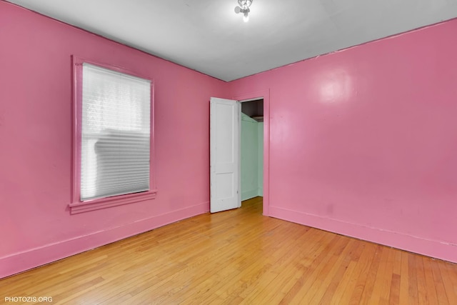 spare room featuring light hardwood / wood-style floors