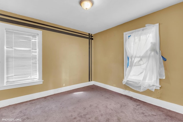 unfurnished room with carpet floors