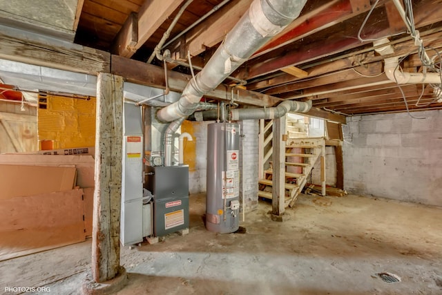 basement featuring water heater and heating unit