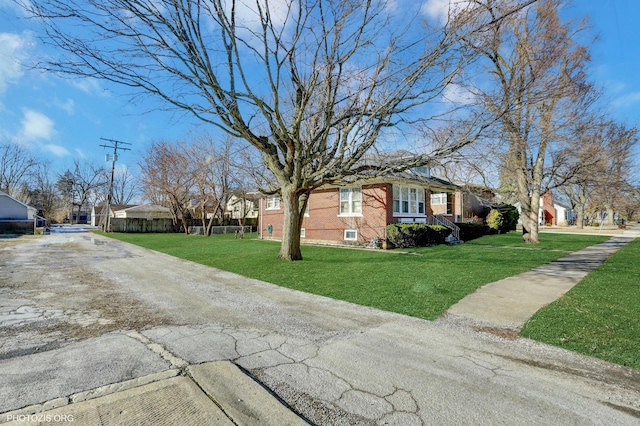 view of side of property featuring a yard