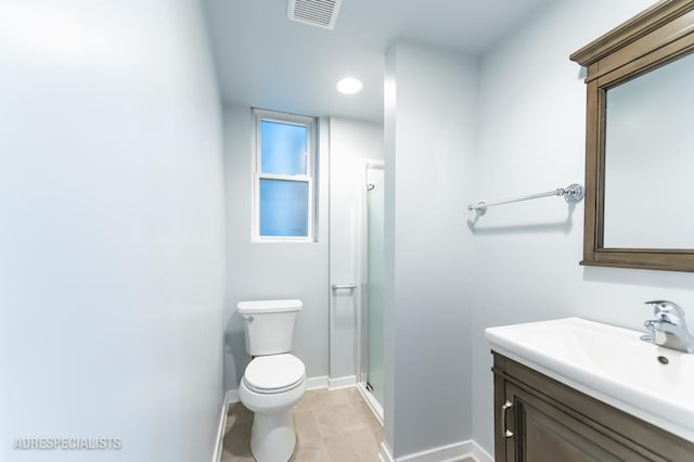 bathroom featuring walk in shower, tile patterned floors, vanity, and toilet