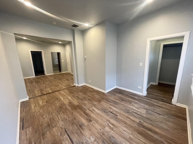 empty room with dark hardwood / wood-style floors