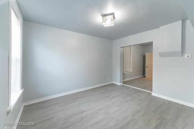 unfurnished room with light hardwood / wood-style floors