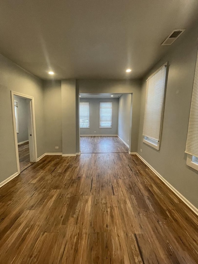 spare room featuring dark hardwood / wood-style floors