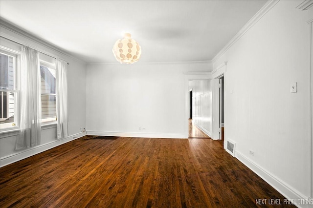 empty room with ornamental molding and dark hardwood / wood-style floors