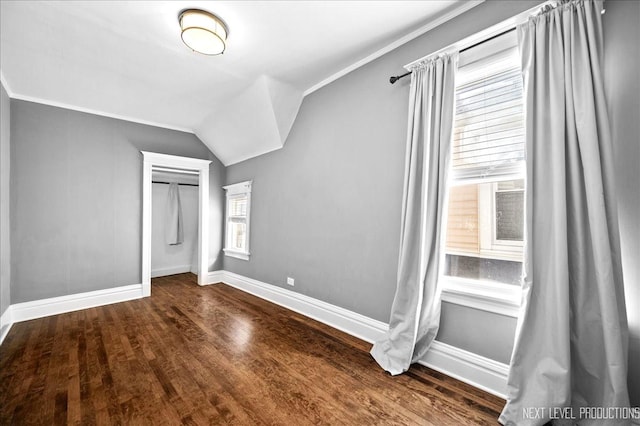 bonus room featuring lofted ceiling and hardwood / wood-style floors