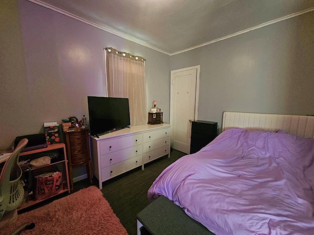 bedroom featuring dark carpet and ornamental molding