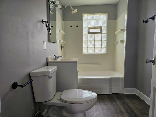 full bathroom with vanity, toilet, bathing tub / shower combination, and hardwood / wood-style floors