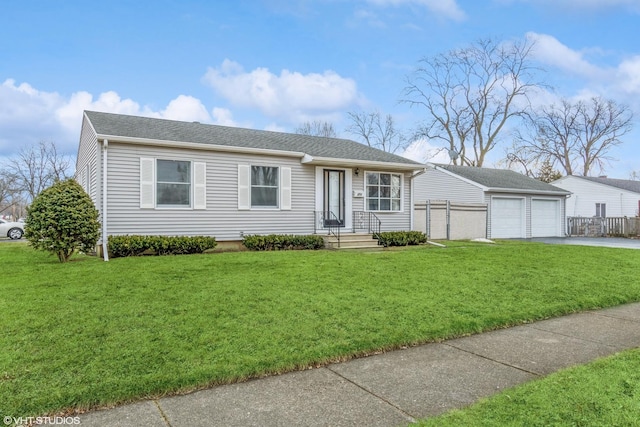 ranch-style home with a garage, an outdoor structure, and a front lawn