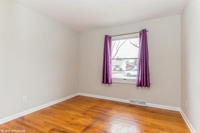 spare room featuring hardwood / wood-style flooring