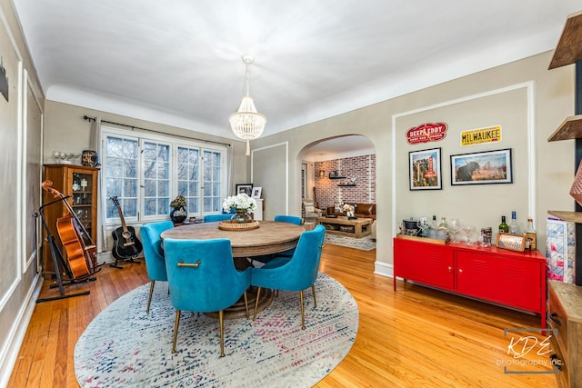 dining room featuring a chandelier and light hardwood / wood-style flooring