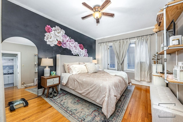 bedroom with hardwood / wood-style flooring and crown molding