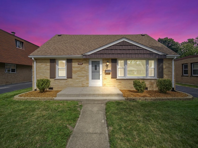 view of front of house with a yard