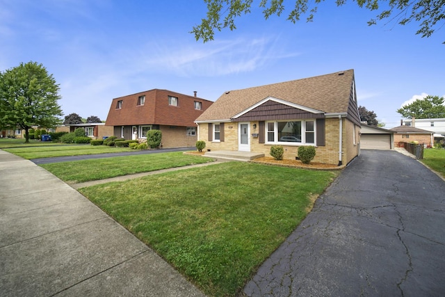 view of front of home with a garage and a front yard