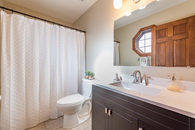 bathroom with vanity, tile patterned floors, and toilet