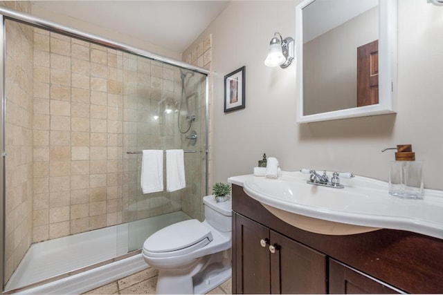 bathroom with walk in shower, vanity, and toilet