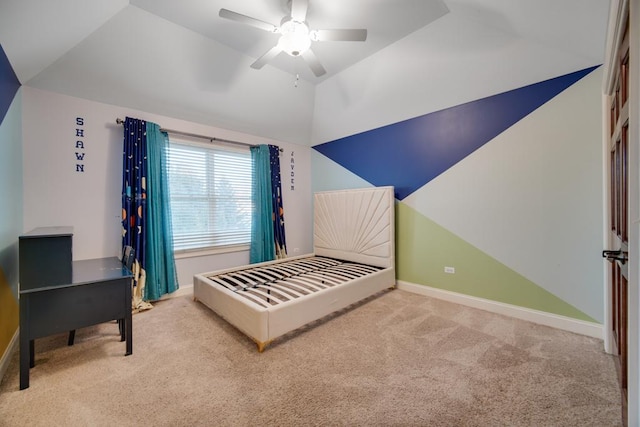 carpeted bedroom with vaulted ceiling and ceiling fan