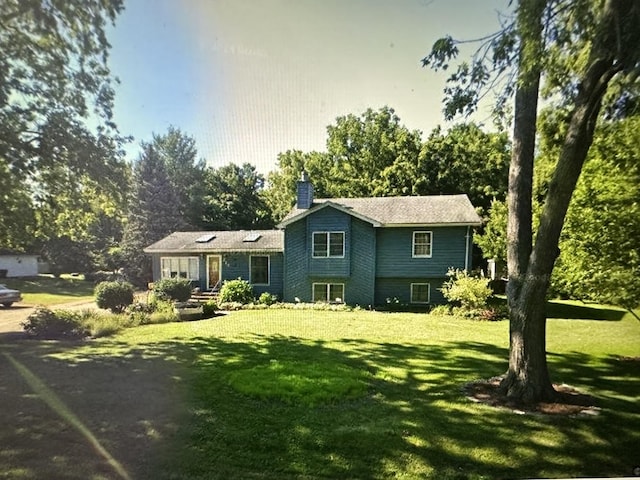 view of front of home with a front yard