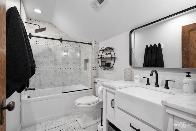 full bath with visible vents, toilet, enclosed tub / shower combo, vaulted ceiling, and vanity