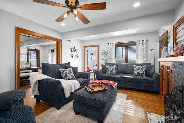 living room featuring ceiling fan, wood finished floors, and recessed lighting