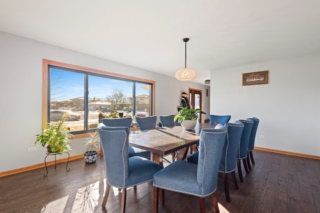 dining area with dark hardwood / wood-style flooring