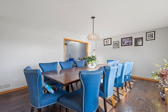 dining space featuring dark hardwood / wood-style flooring