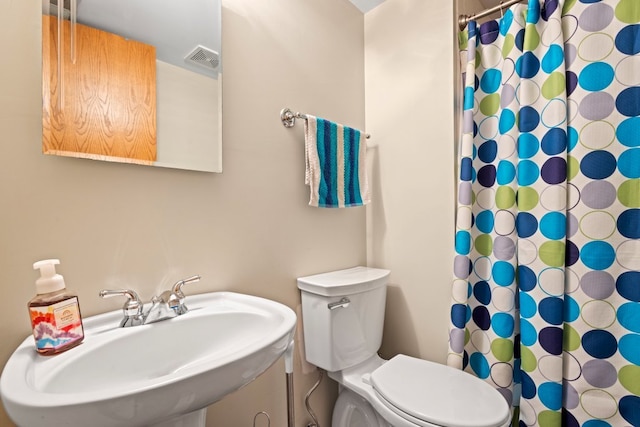 bathroom with sink and toilet